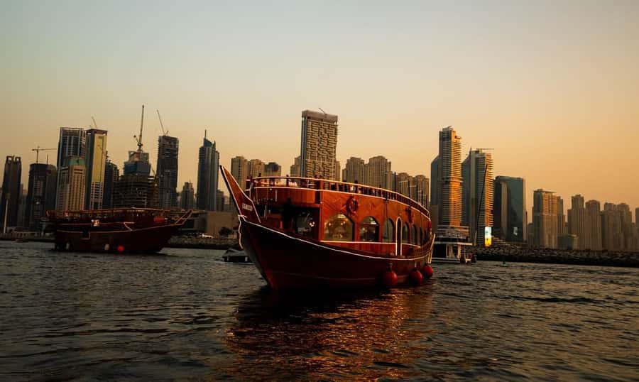 5-Star Marina Dhow Dinner Cruise With Live Entertainment - Riding a traditional dhow past Dubai Marina’s lit skyline