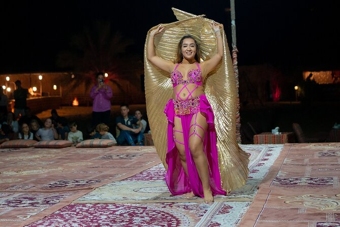 Abu Dhabi: 7-Hours Desert Safari with BBQ, Camel Ride & Sandboarding - Sandboarding near camp, the activity that makes the desert feel real