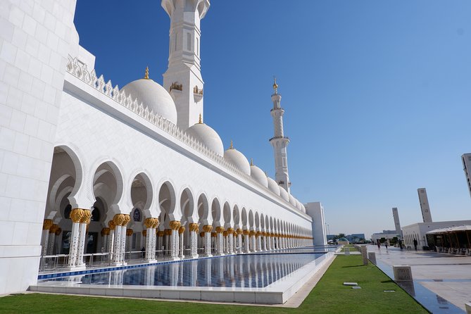 Abu Dhabi City Tour & Sheikh Zayed Grand Drive through Louver Museum - The real star: Sheikh Zayed Grand Mosque inside and around the reflecting pool