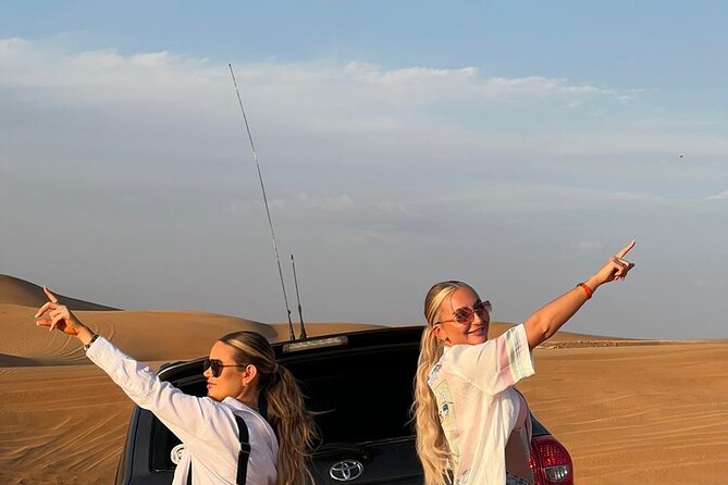 Abu Dhabi Desert Safari BBQ Dinner Live Shows Pick & Drop More - Camel Riding and Sandboarding in the Desert Evening