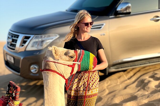 Abu Dhabi Desert Safari Tour with Shows & Buffet Dinner - Al Ajban dune bashing, sandboarding, and the sunset photo stop