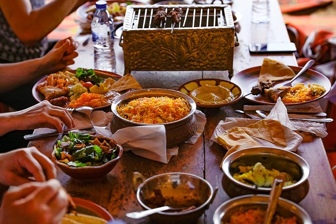 Abu Dhabi: Desert Safari with BBQ, Camel Ride & Sandboarding - Bedouin camp arrival: coffee, dates, henna, and shisha