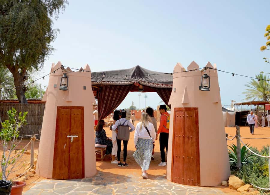 Abu Dhabi: Inside Heritage Village Walking Tour - Bedouin camp stops: tents, fire pit, and desert-life context
