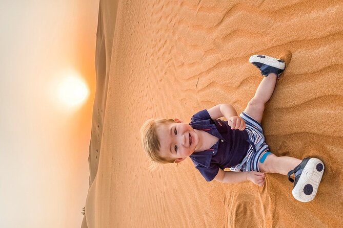 Abu Dhabi - Kids Friendly Morning Desert Safari - Sandboarding after the driving: where the adrenaline turns into laughs