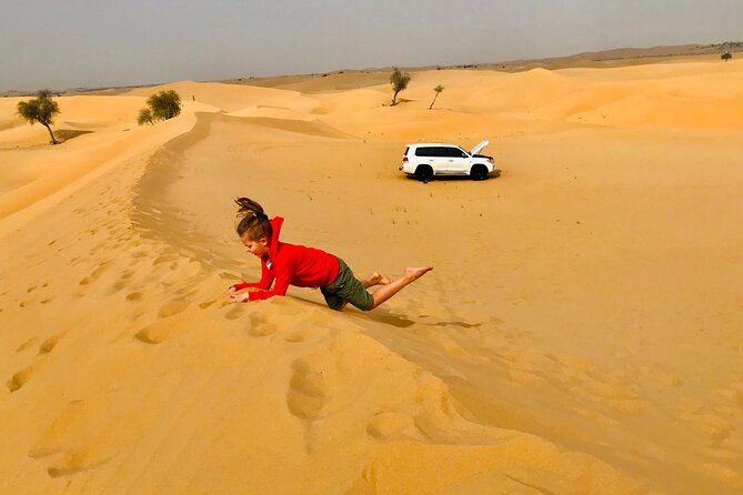 Abu Dhabi Morning Desert Safari,Dune Bashing,Sandboarding,Camel Riding&Quad Bike - Campsite time: camel riding, sandboarding, and refreshments