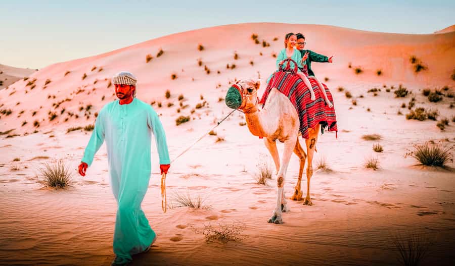 Abu Dhabi: Morning Dune Drive, Camel Ride & Sandboarding - Sandboarding on Golden Dunes: Where Fun Gets Real