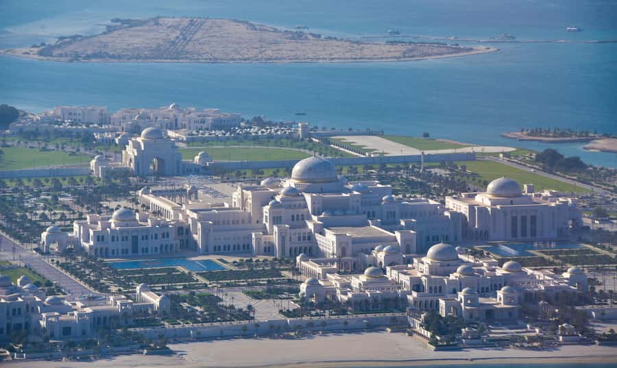 Abu Dhabi: Shared Helicopter Tour - Al Hudayriat Island turquoise water and Capital Gate’s leaning silhouette
