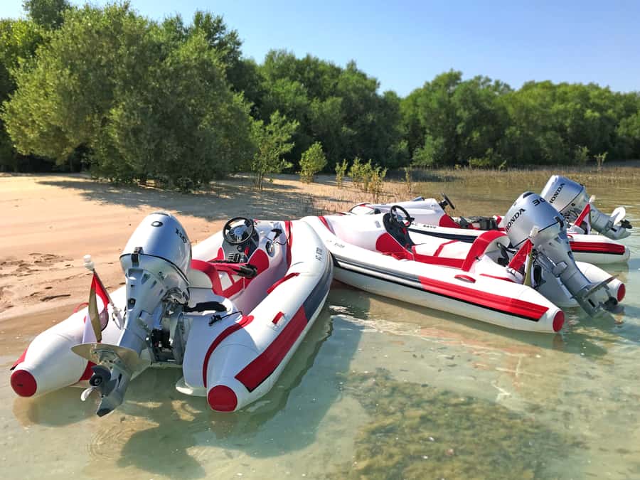 Abu Dhabi: Yas Island Self-Driving Guided Speedboat Tour - Peninsula Gold Beach: swim option, picnic vibes, quick reset