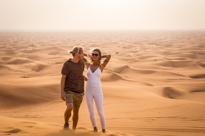 Adventurous Red Dune Desert Safari Deal with Quad Bike,Shows &BBQ - The Shows Program: Belly Dance, Tanoura, Fire Acts, and Stick Man