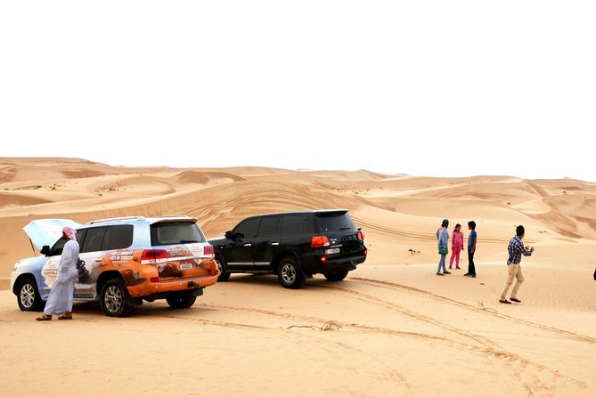 Al Ain Desert Safari with Buffet Dinner - 4WD dune bashing, camel rides, and sandboarding: the action sequence