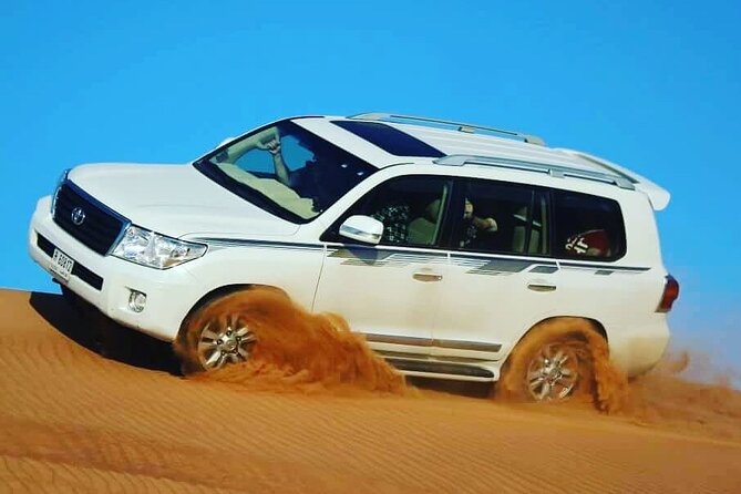 Arabian Desert Safari with BBQ Dinner & Camel Riding - From your hotel to the dunes: pickup, timing, and the “high dune” moment