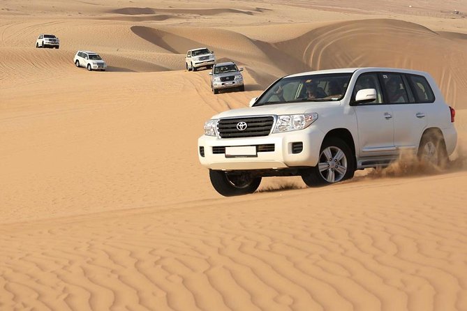 Best Dubai Desert Safari with Buffet Dinner,Sand Boarding & Shows - Camel Riding, Henna, Shisha, and Local Costume Moments at Camp