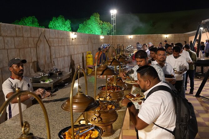 Deluxe Premium Dubai Desert Safari with Camel Ride, and Live Show - Dinner in premium seats: BBQ, live cooking, and unlimited drinks