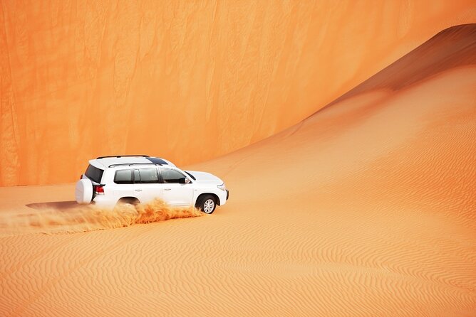 Desert Safari Abu Dhabi w/ Sand Boarding, Camel Ride & BBQ Dinner - Belly Dance and Tanoura, Plus the Night Show Energy