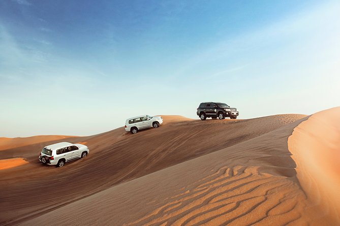 Desert Safari Dubai with Dune Bashing, Sandboarding, Camel Ride, 5 Shows, Dinner - Pickup in 4x4 Cars, and Why Al Awir Matters