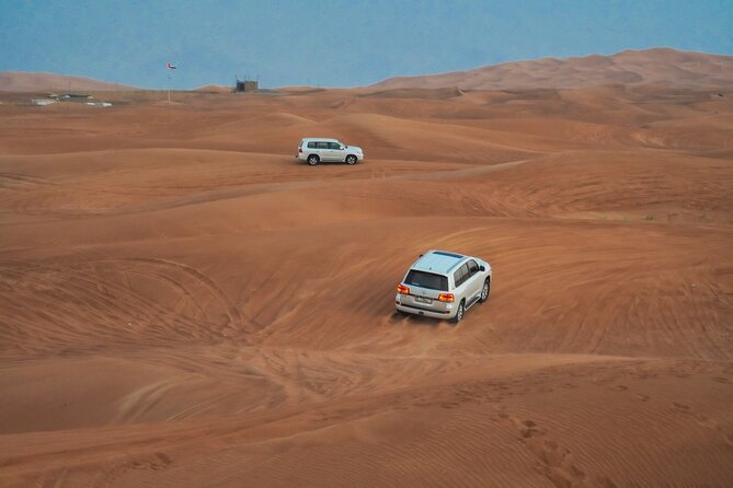 Desert Safari, Open Desert Quad Bike Experience with BBQ Dinner - Lahbab and Camp Activities: Sandboarding and Camel Riding