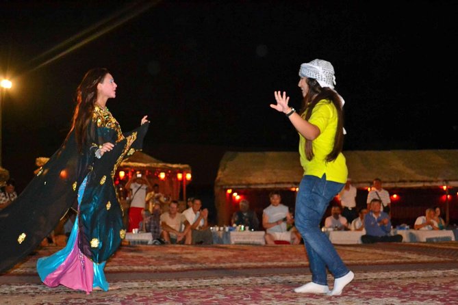 Dinner in Dubai Desert with Camel Ride, BBQ Dinner and Belly Dance - Sandboarding, henna, and Arabic dress photos