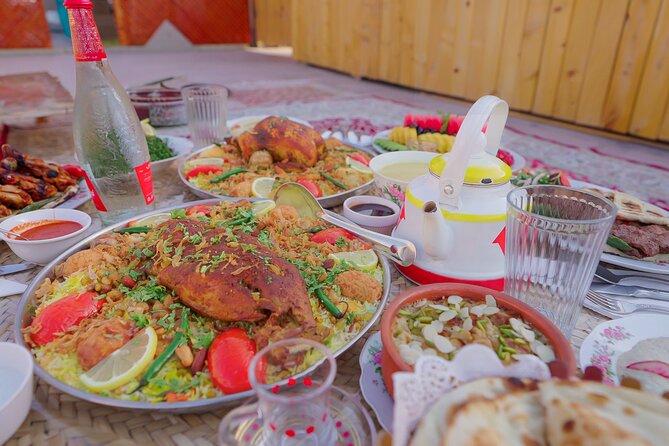 Dubai: Al Marmoom Oasis Vintage Safari: Camels, Stargazing & Meal - Stop for dunes and photos, then into the Bedouin Village welcome