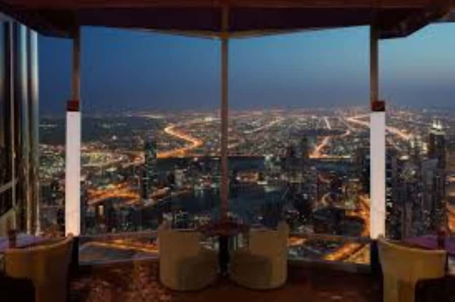 Dubai: Burj Khalifa Sunset Engagement with Porsche Pickup - Champagne toast, cocktails, and the perfume keepsake