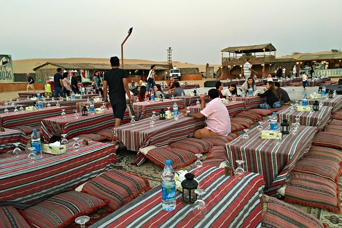 Dubai: Desert Camel Ride with Live Shows & BBQ Buffet Dinner - Bedouin camp welcome: coffee, dates, shisha, henna, and dress-up