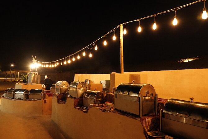 Dubai Desert Camp Dinner with BBQ, Dinner, Camel Ride & Shows - Belly Dance, Tanura, and Fire Shows Under the Stars