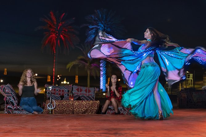 Dubai Desert Camp Dinner with BBQ, Dinner, Camel Ride & Shows - Henna, Palm Reading, Souq Stroll, and Falcon Moments