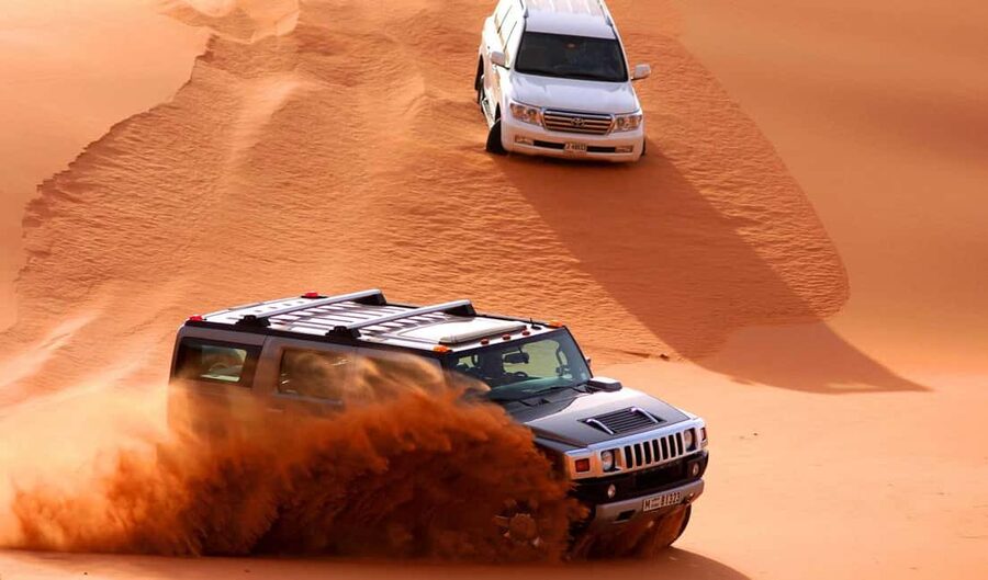 Dubai: Desert Safari, Camel, Quad Ride & Mesmerizing Shows - Sandboarding and Desert Photo Stops: Better Than Just Pretty Views