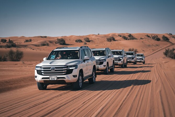 Dubai Desert Safari: Camel Ride, Sandboarding, BBQ & House Drinks - From hotel pickup to the dune ride, this is all about timing