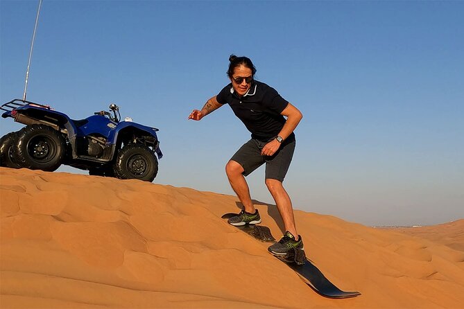 Dubai: Desert Safari, Camel Ride, Show & Optional Dinner - Sandboarding stop: your feet meet the dunes