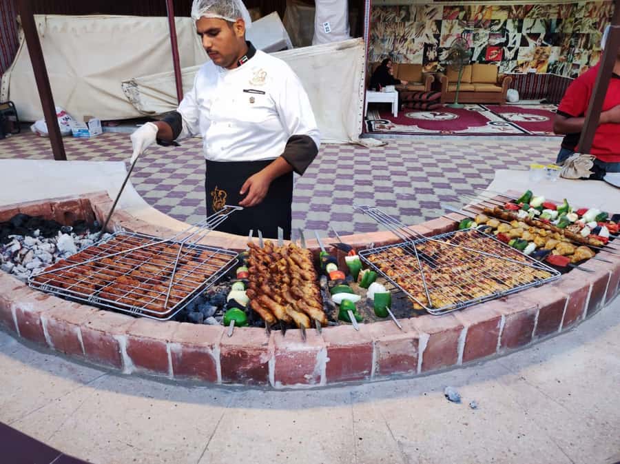 Dubai: Desert Safari Camel Riding, Sandboarding & BBQ Dinner - Camp Evening: Rose Water Welcome, Henna, Shisha, and Shows