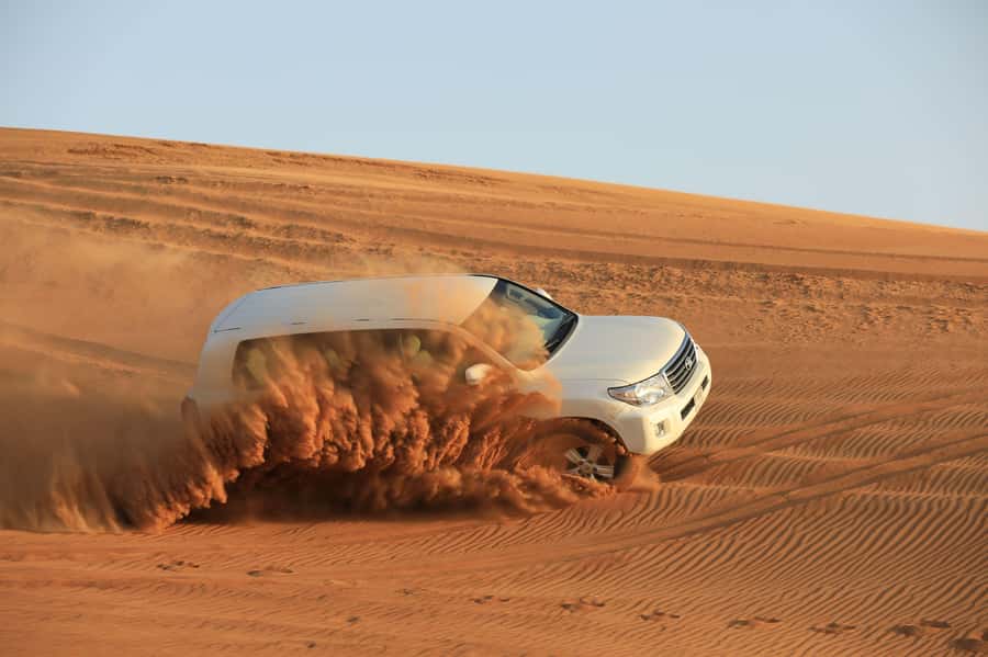 Dubai: Desert Safari, Quad Bike, Sandboarding, Camels & BBQ - BBQ dinner and evening shows: what to expect after sunset