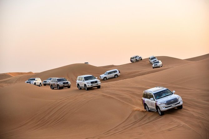 Dubai Desert Safari with BBQ And 4W Land Cruiser Dune Bashing Experience - A Sunset-Ready Desert Evening Just Outside Dubai
