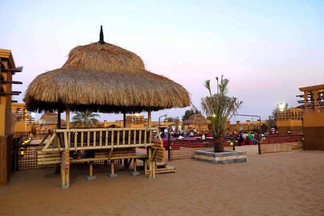 Dubai Desert Safari with Dune Bashing, Camel Rides & BBQ - Sand boarding: turning the dune into a slide