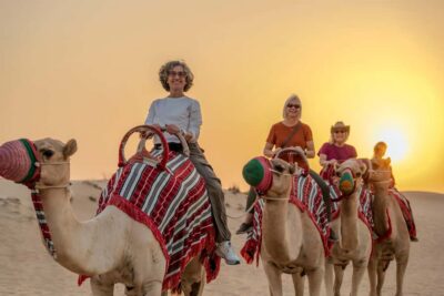 Evening Camel Trekking & Dinner at Al Marmoom Oasis