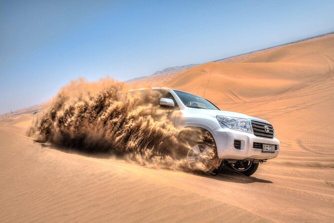 Dubai Evening Desert Safari & BBQ Dinner - Camp time in Al Awir: camel ride, sandboarding, and henna