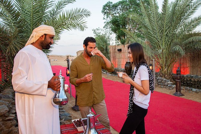 Dubai Evening Desert Safari: Sandboarding, BBQ, Camel Ride & more - Bedouin Dinner and Performances Under the Stars