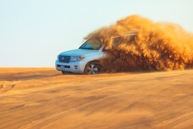 Dubai Evening Desert Safari With Transfers Dune Bashing & Dinner - Dune Bashing and Sandboarding, the Part You Will Remember