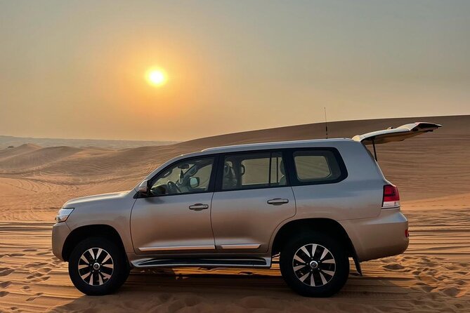 Dubai Evening Desert Safari With Transfers Dune Bashing & Dinner - Live Shows, Fire, Belly Dance, Tanoura, and the Energy Cut