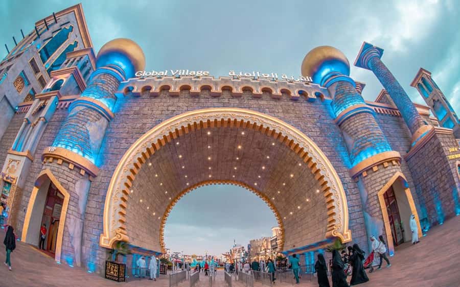 Dubai: Global Village Entry Ticket with Hotel Transfers - Global Village at night: a world fair that moves fast