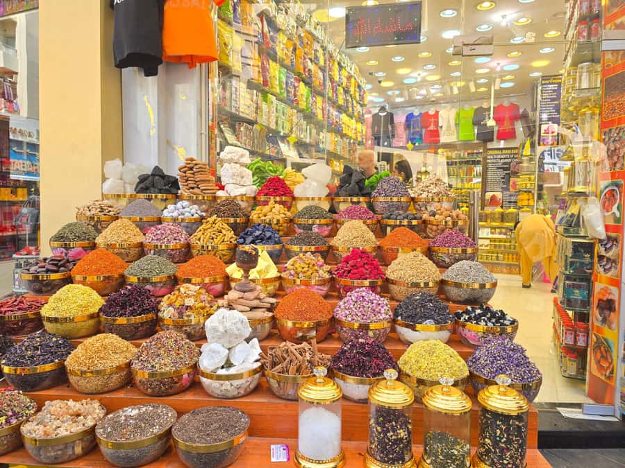 Dubai: Guided City Walking Tour to Spice and Gold Souk - Textile market stop: what 15 minutes can teach you