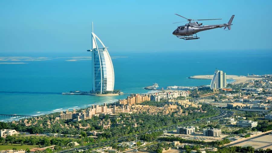Dubai: Helicopter Ride, Old Town Walking Tour, Abra & Snacks - From hotel pickup to souk time: how the day really moves