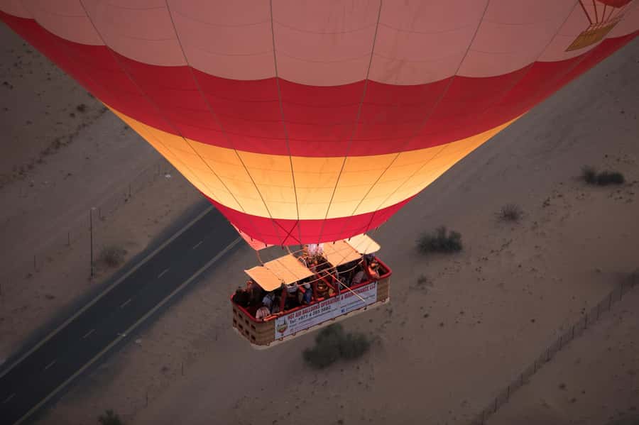 Dubai: Hot Air Balloon Ride with Camel Ride & Falcon Show - Dubai desert at sunrise, from 4,000 feet up