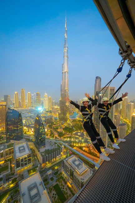 Dubai Iconic Burj Khalifa + Aquarium + Sky Views Ticket - Sky Views Observatory and the glass slide: fun, but follow the safety signage
