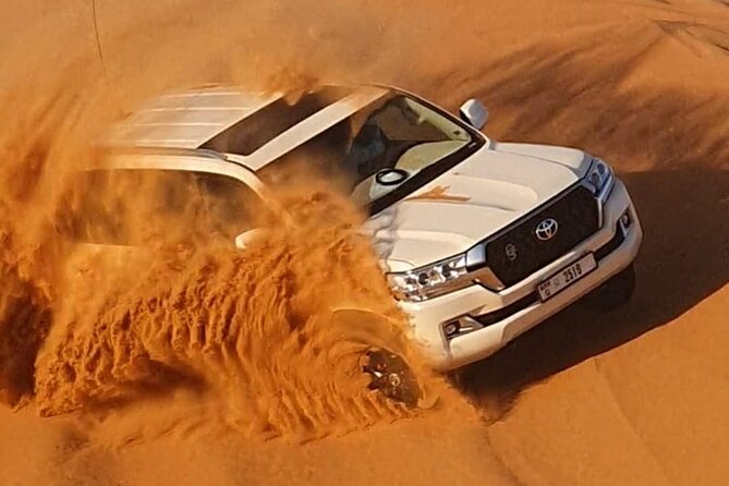 Dubai: Jeep Desert Safari, Camel Ride, and Quad Bike Tour - Quad bike riding: helmets on, confidence up