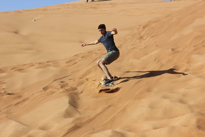 Dubai: Jeep Desert Safari, Camel Ride, and Quad Bike Tour - Sandboarding stop: controlled fun and photo opportunities