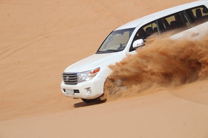 Dubai: Jeep Desert Safari, Camel Ride, and Quad Bike Tour - Al Aweer Camp BBQ and traditional entertainment