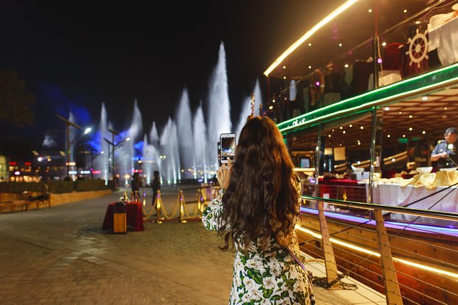 Dubai Luxury Canal Dinner Cruise with Optional Transfer - Sailing the canal at night: Burj Khalifa, Downtown, and the waterfall bridge
