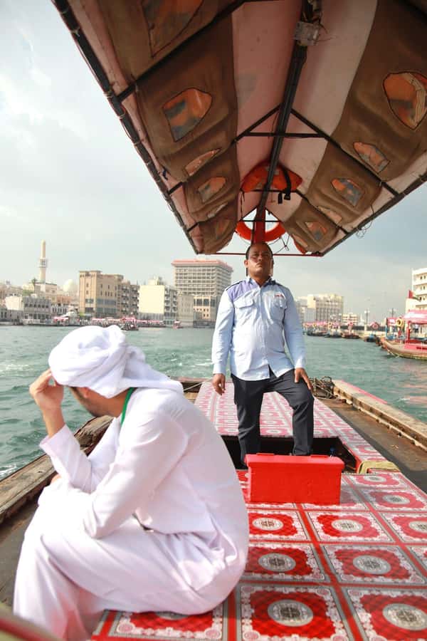Dubai: Old City Walking Tour with Abra Ride - Al Fahidi Fort and the old textile market lanes
