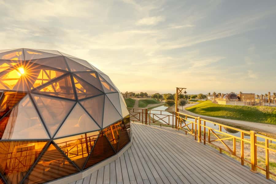 Dubai: Overnight Safari with Luxury Dome Stay & Stargazing - Red dunes safari: dune bashing, sandboarding, and a camel ride in twilight