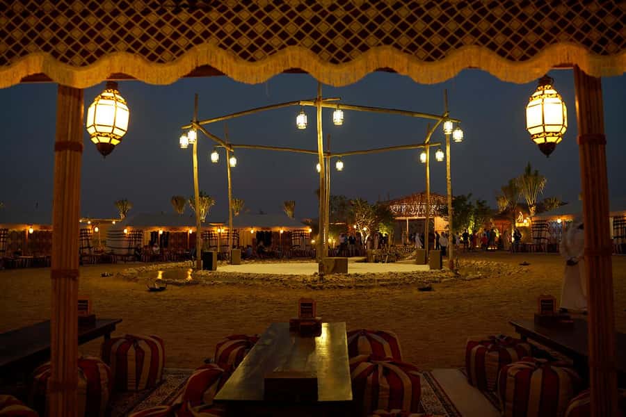 Dubai: Premium Safari, Camel Ride & Al Khayma Camp 3-Buffets - Camp Activities and Shows After Sunset: Henna, Falconry, Fire, and More